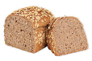 Par-baked Organic multigrain bread in box form sprinkled with oatmeal.
