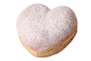 Fully baked doughnut in heartshape with a multi-fruit filling and powdered sugar.